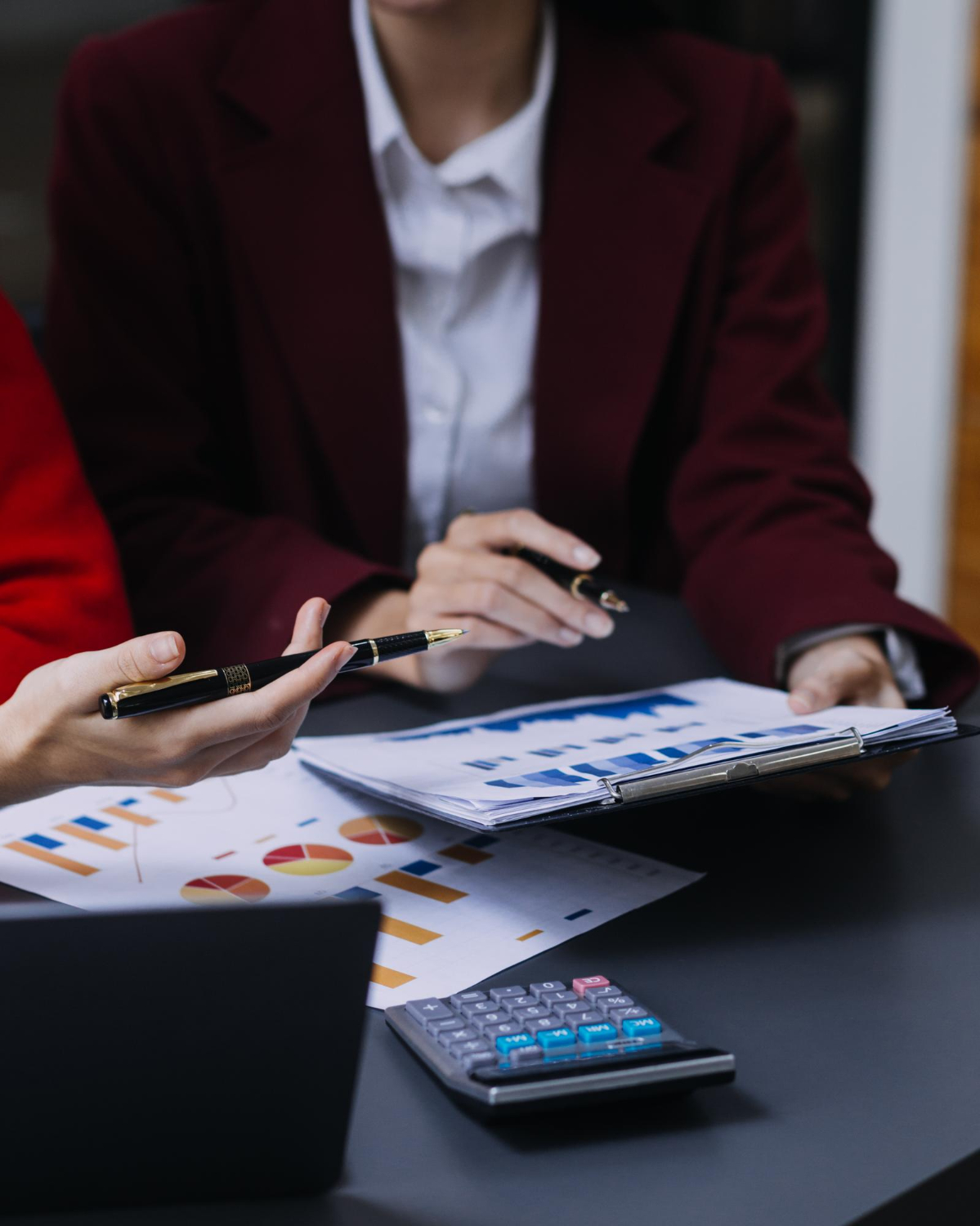 Accounting professionals reviewing financial reports in Delta