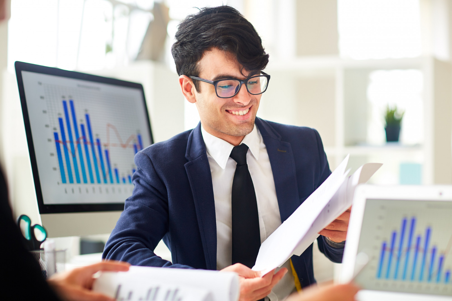 Business professional reviewing financial reports in Hope